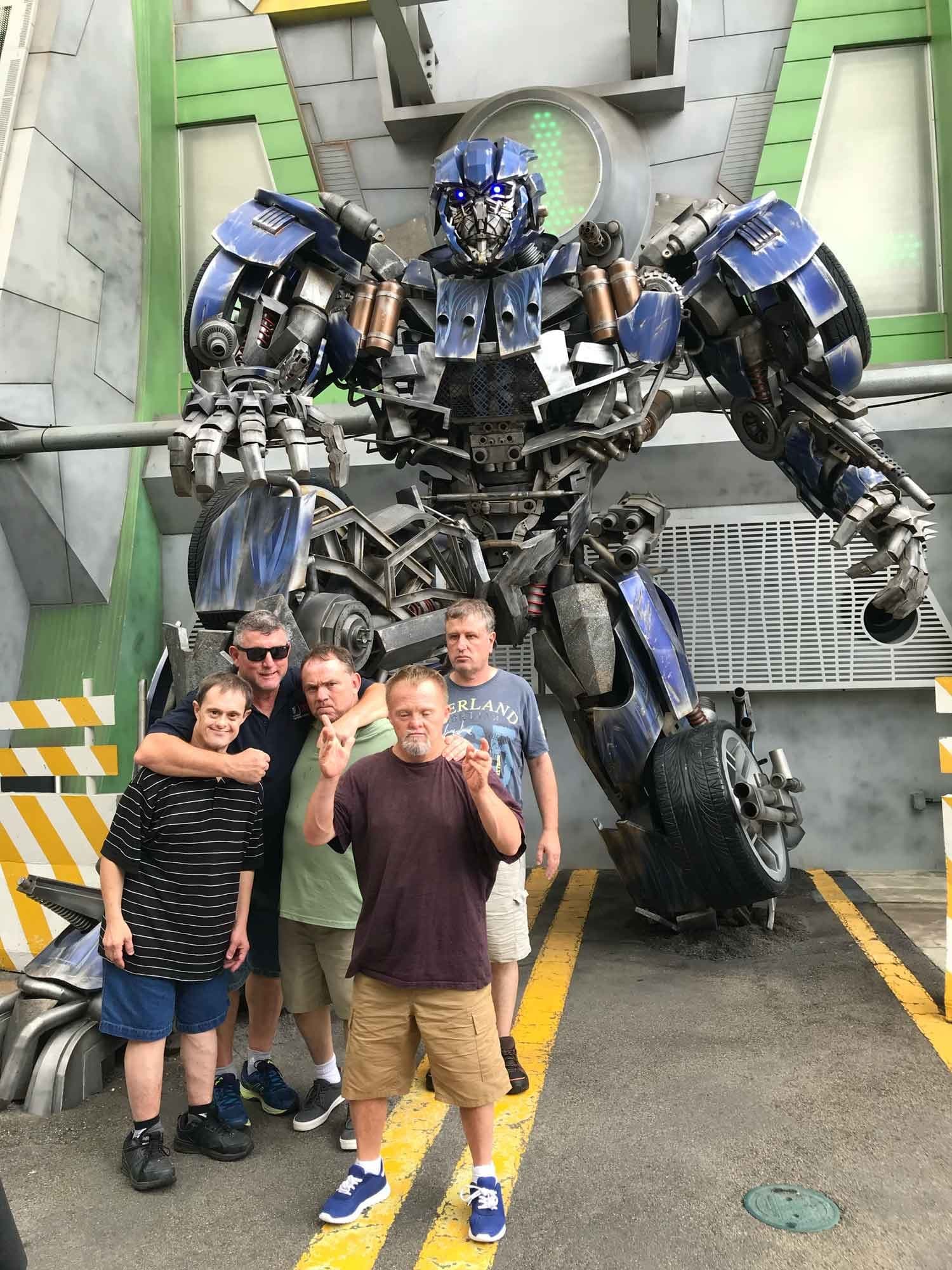 Participants enjoying rides at a Gold Coast theme park on a 4titude supported holiday