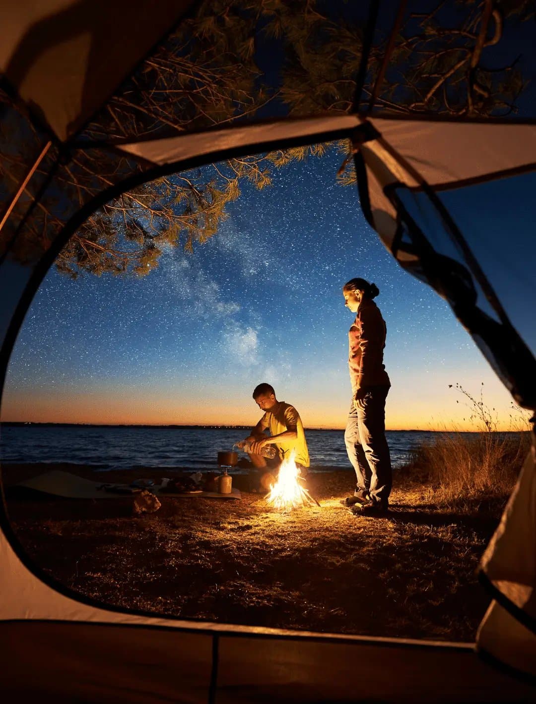 Kids and teens at a 4titude overnight camp with campfire activities